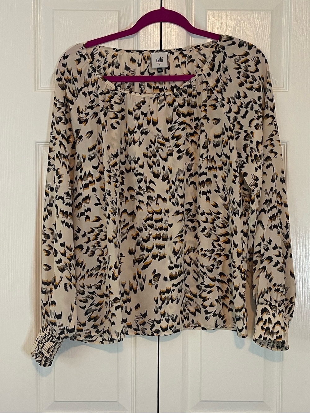 CAbi Beige Long Sleeve Blouse with Black and Gold Pattern
Size Small
Never worn